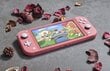 Nintendo Switch Lite (Coral) Animal Crossing cena un informācija | Spēļu konsoles | 220.lv