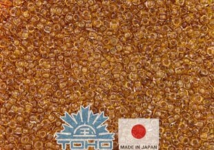 Бисер TOHO® Seed Beads Transparent Honey 11/0 (2,2 мм) 10 г. цена и информация | Принадлежности для изготовления украшений, бисероплетения | 220.lv
