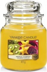 Ароматическая свеча Yankee Candle Tropical Starfruit 411 г цена и информация | Подсвечники, свечи | 220.lv