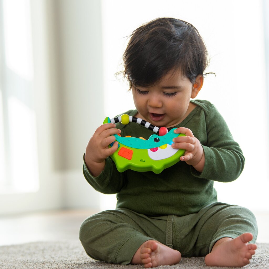 SASSY Muzikālā rotaļlieta “Krokodils” cena un informācija | Rotaļlietas zīdaiņiem | 220.lv
