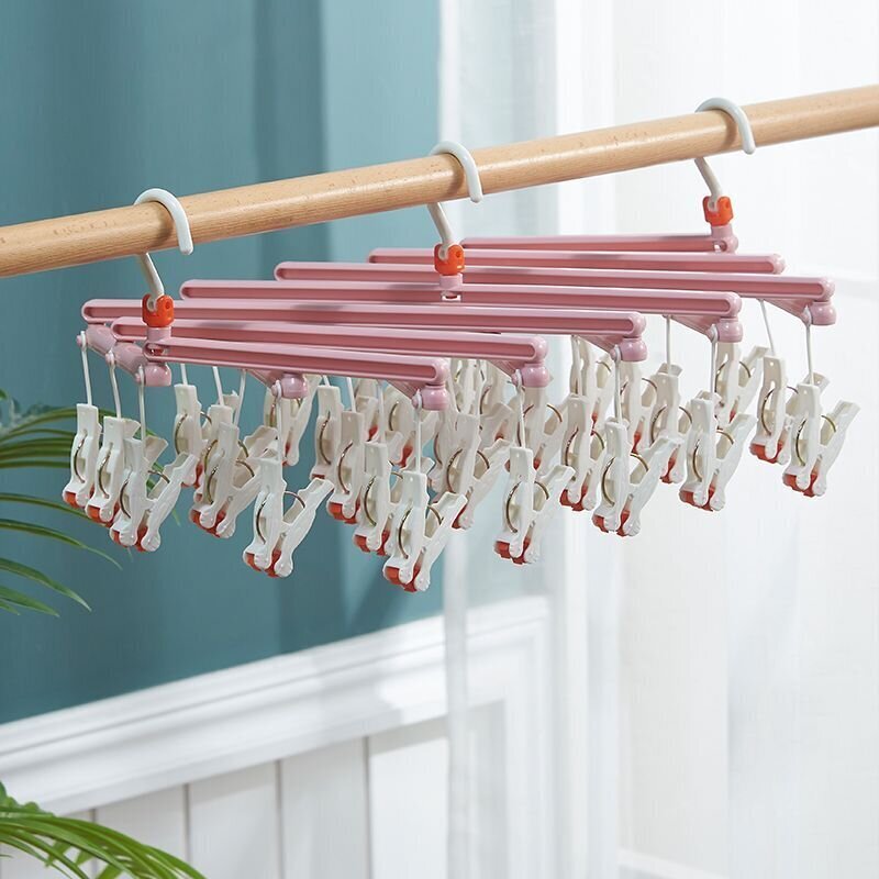 Plastmasas saliekamo drēbju pakaramais ar klipiem - 14 klipi - rozā krāsā цена и информация | Pakaramie un apģērbu maisi | 220.lv