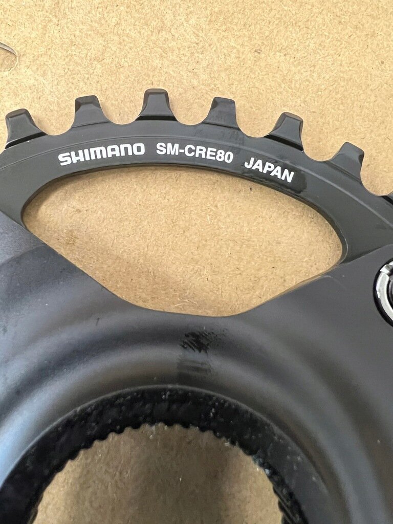 Šarnīrs ar zobratu Shimano Steps SM-CRE80 34T 10/11S, melns cena un informācija | Citas velosipēdu rezerves daļas | 220.lv